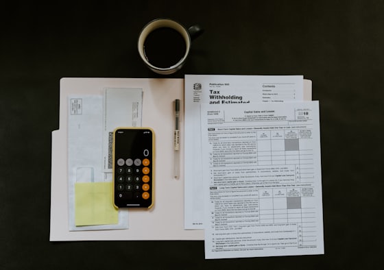 Tax paperwork and folder on a desk